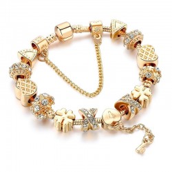 Trendy gouden armband met bedels - hartjes - kralen - klavertje - sleutelArmbanden