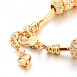 Elegante gouden armband - met kristallen kralen en hartjeArmbanden