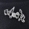 Musical notes - crystal brooch