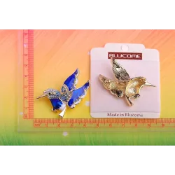 Elegant brooch - with green crystal bird