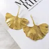 Gouden oorbellen in de vorm van bladeren - metaalOorbellen