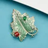 Broche luxueuse en cristal - scarabée rouge / feuille verte