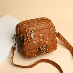Petit sac bandoulière / taille - cuir - rivets - fermetures éclair