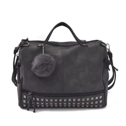 Vintage tas van nubuckleer met klinknagels / pom pom van bontTassen