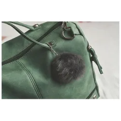 Vintage tas van nubuckleer met klinknagels / pom pom van bontTassen