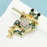Grenouille en cristal jouant de la flûte - broche