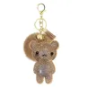 Ourson en cristal avec pompon en fourrure - porte-clés