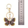 Porte-clés doré avec un papillon en cristal