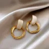 Elegante gouden ronde oorbellen - met witte opaalOorbellen