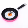 Metal wall clock in the shape of a frying pan with a fried eggClocks