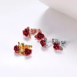 Gold stud earrings with red roseOorbellen